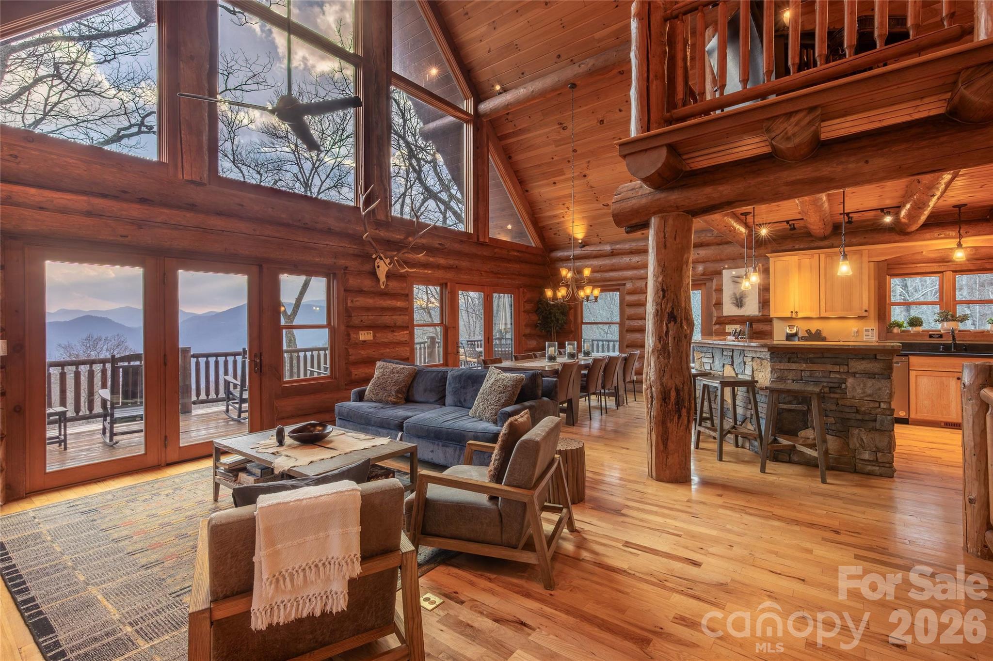 1391 Still Branch Road Sylva, NC 28779 - Photo 10 of 40 a living room with furniture a floor to ceiling windows and floor to ceiling windows