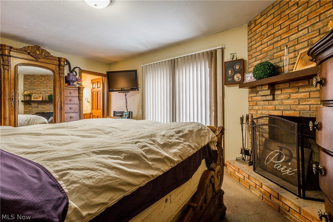 5045 Johnnycake Ridge Northeast Canton, OH 44705 - Photo 11 of 35 Cozy Brick Fireplace