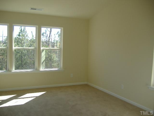 2836 Casona Way, Unit 731 Raleigh, NC 27616 - Photo 7 of 12 an empty room with a window