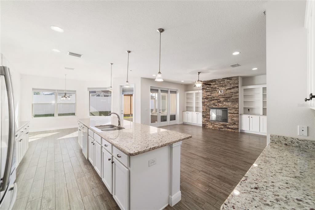 6429 Southwest 45th Avenue Ocala, FL 34474 - Photo 14 of 56 a kitchen with stainless steel appliances granite countertop a lot of counter space and wooden floor