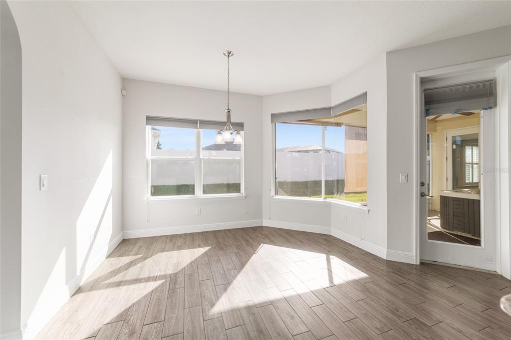 6429 Southwest 45th Avenue Ocala, FL 34474 - Photo 19 of 56 a view of an empty room with wooden floor and a window