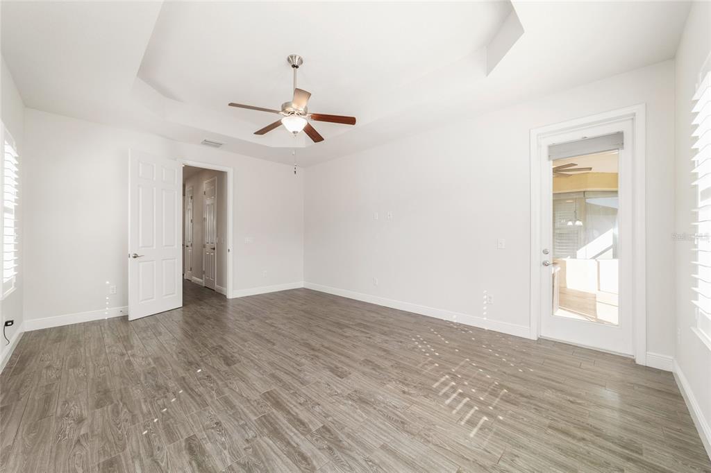 6429 Southwest 45th Avenue Ocala, FL 34474 - Photo 27 of 56 a view of empty room with wooden floor and fan