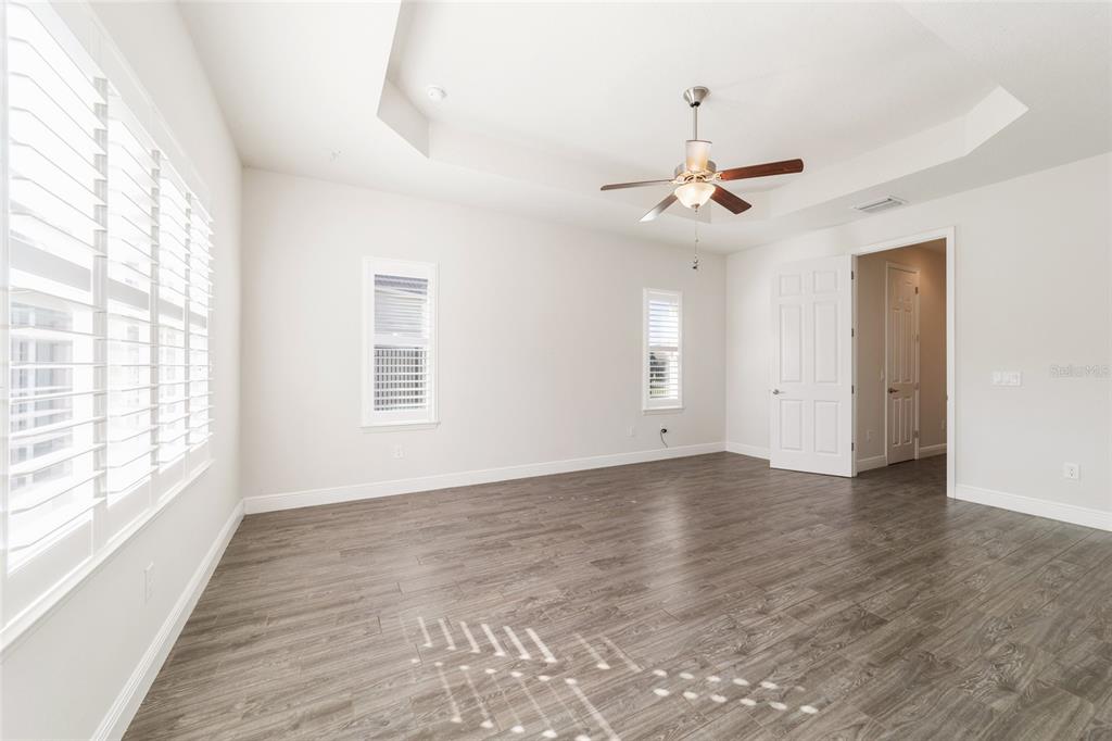 6429 Southwest 45th Avenue Ocala, FL 34474 - Photo 28 of 56 wooden floor in an empty room with a window