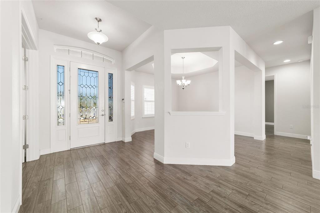 6429 Southwest 45th Avenue Ocala, FL 34474 - Photo 31 of 56 a view of a big room with wooden floor and a kitchen