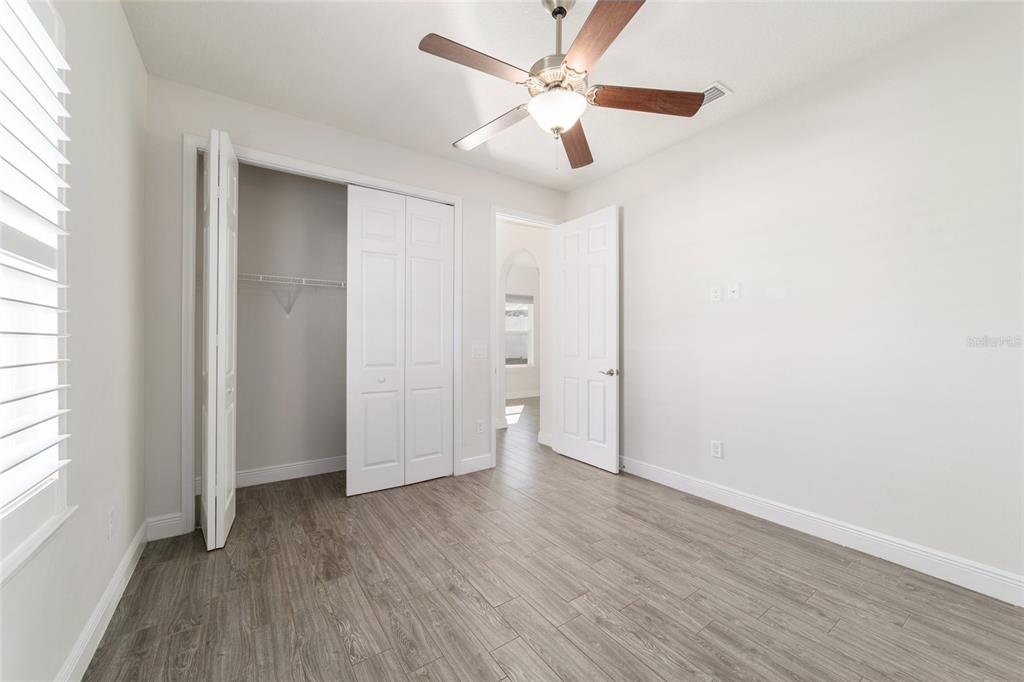 6429 Southwest 45th Avenue Ocala, FL 34474 - Photo 40 of 56 wooden floor in an empty room with a window