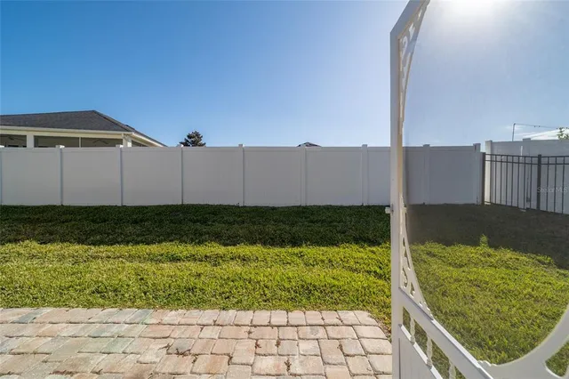 an aerial view of a house with a swimming pool