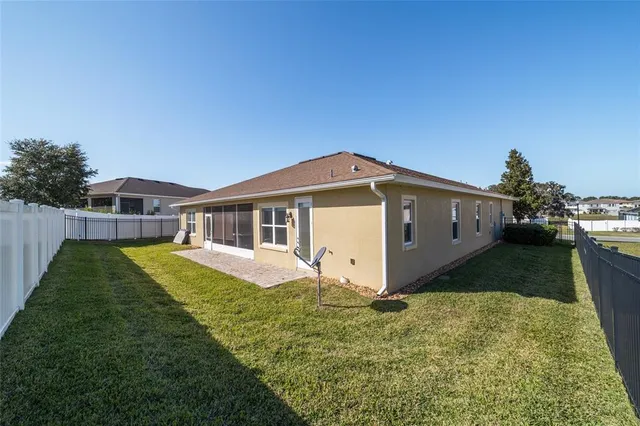 an aerial view of residential house with outdoor space