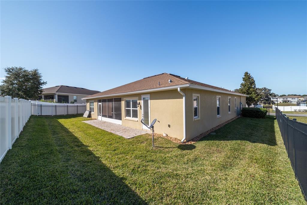 6429 Southwest 45th Avenue Ocala, FL 34474 - Photo 48 of 56 a front view of a house with a yard