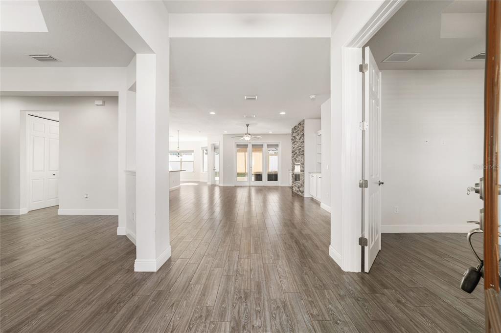 6429 Southwest 45th Avenue Ocala, FL 34474 - Photo 5 of 56 a view of a hallway with wooden floor