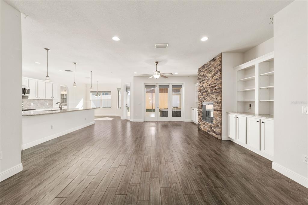 6429 Southwest 45th Avenue Ocala, FL 34474 - Photo 7 of 56 a view of a kitchen with wooden floor and a window