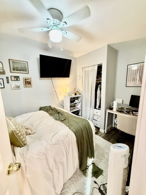 14 Cleveland Place, Unit 3 Boston, MA 02113 - Photo 21 of 22 a bedroom with a bed a flat screen tv and a chandelier