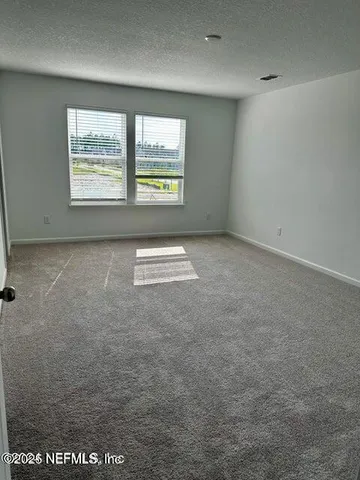 a bathroom with a shower a toilet and sink