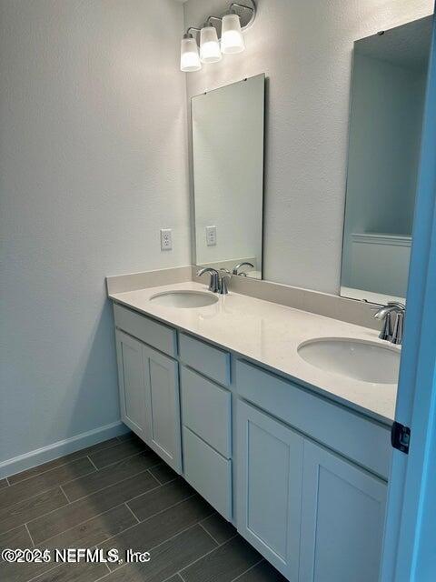 389 Belfort Court St. Augustine, FL 32092 - Photo 17 of 24 a bathroom with a sink and a mirror