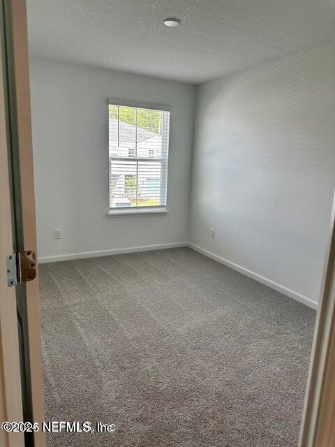 389 Belfort Court St. Augustine, FL 32092 - Photo 21 of 24 an empty room with a window