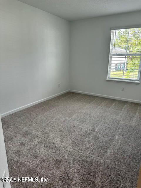 389 Belfort Court St. Augustine, FL 32092 - Photo 22 of 24 an empty room with a window