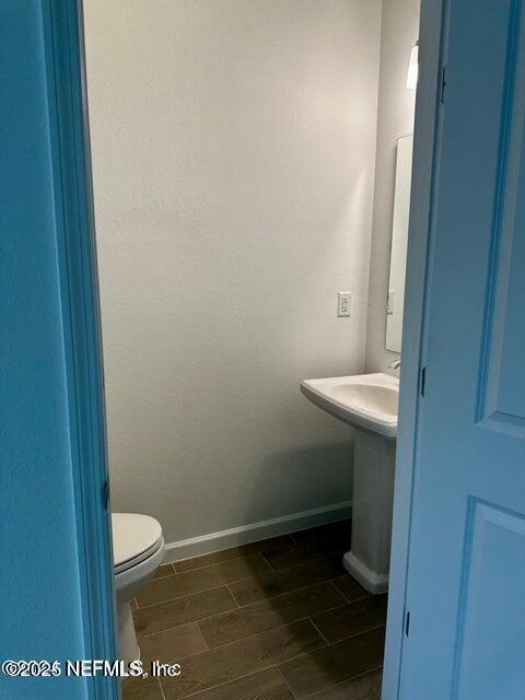 389 Belfort Court St. Augustine, FL 32092 - Photo 23 of 24 a bathroom with a sink and toilet