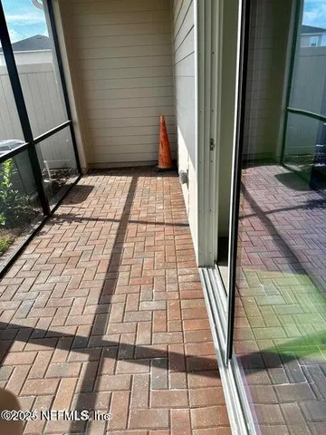 a bathroom with a glass door shower