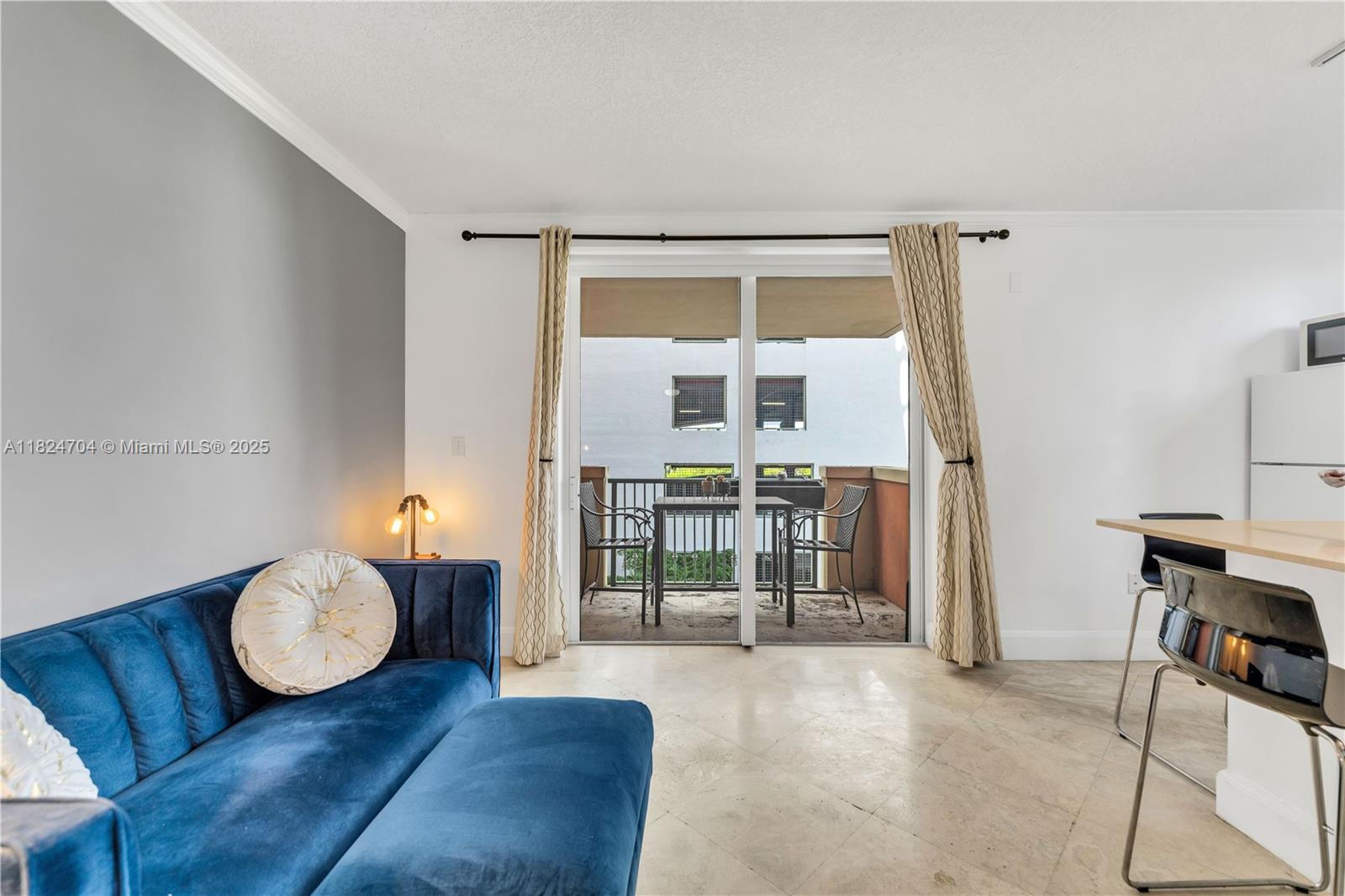 2951 South Bayshore Drive, Unit 717 Miami, FL 33133 - Photo 14 of 31 a living room with furniture and a fireplace