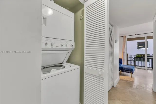 a large white bedroom with a large bed and furniture