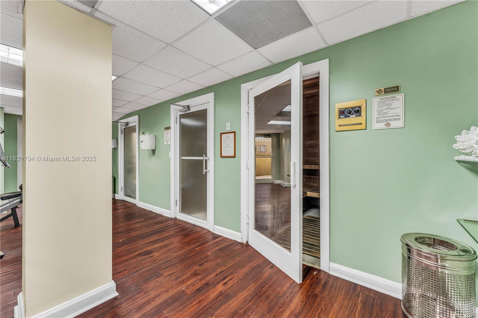 2951 South Bayshore Drive, Unit 717 Miami, FL 33133 - Photo 8 of 31 wooden floor in a hall with an entryway