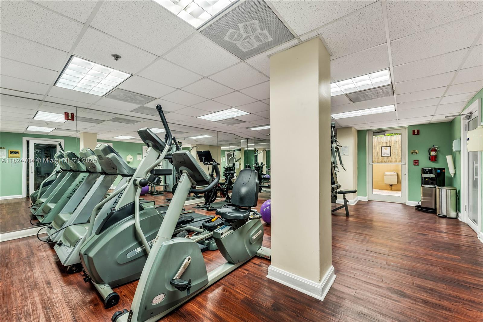 2951 South Bayshore Drive, Unit 717 Miami, FL 33133 - Photo 9 of 31 a view of a room with gym equipment
