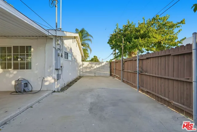 a pathway of a house with a yard