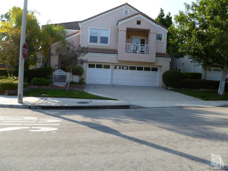 11667 Pinedale Road Moorpark, CA 93021 - Photo 1 of 7 a front view of a house with a garden and plants
