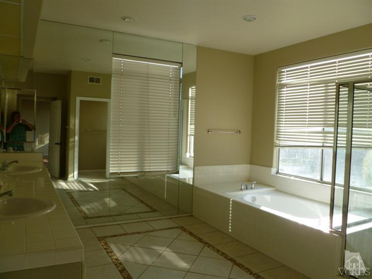 11667 Pinedale Road Moorpark, CA 93021 - Photo 3 of 7 a bathroom with a bathtub and a sink