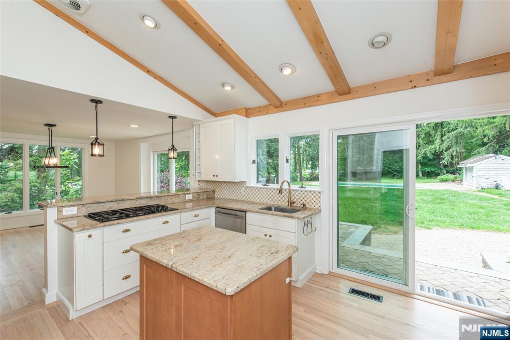 163 Sand Spring Road Morristown, NJ 07960 - Photo 6 of 39 a kitchen with a sink stove and cabinets