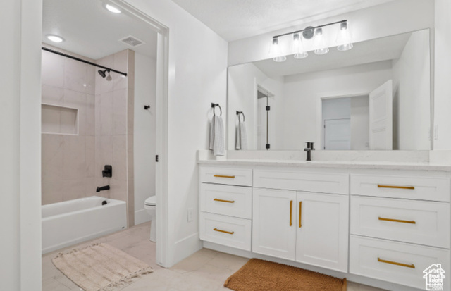 599 North Heritage Street, Unit 6 Mapleton, UT 84664 - Photo 25 of 37 Full bathroom featuring vanity, tile patterned flooring, tiled shower / bath combo, and toilet