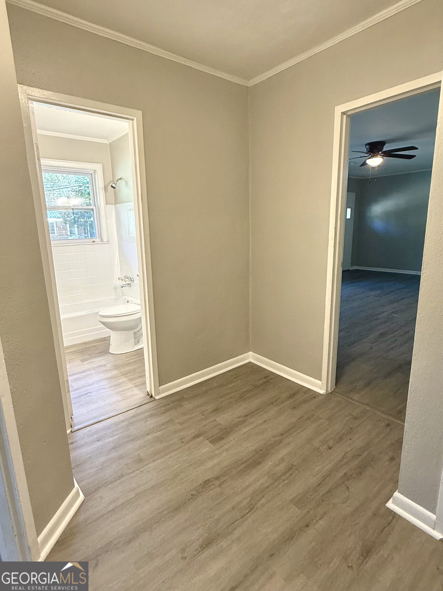 226 Poplar Street Toccoa, GA 30577 - Photo 12 of 17 an empty room with wooden floor and a window