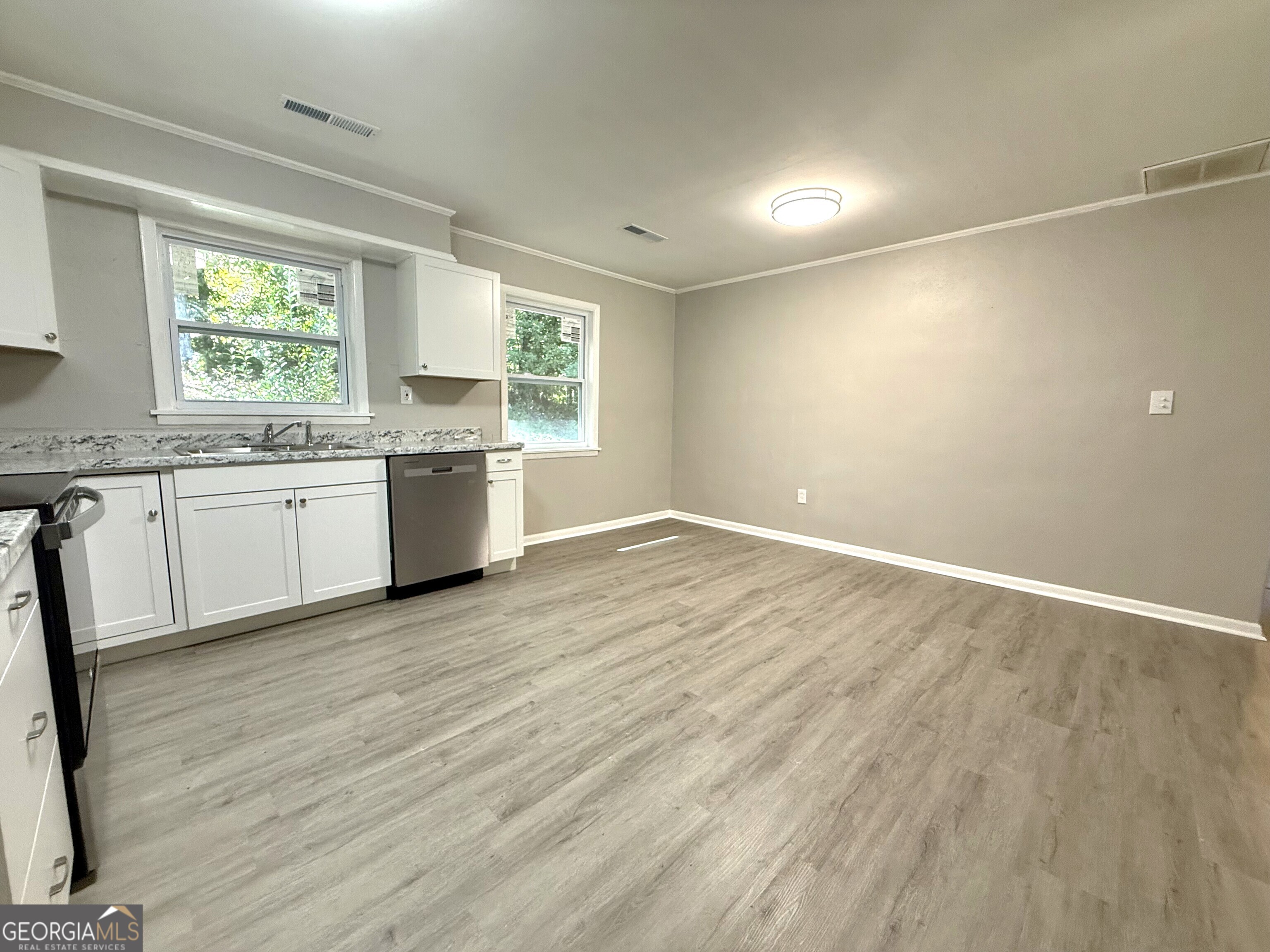 226 Poplar Street Toccoa, GA 30577 - Photo 4 of 17 a view of a kitchen with a sink and a window