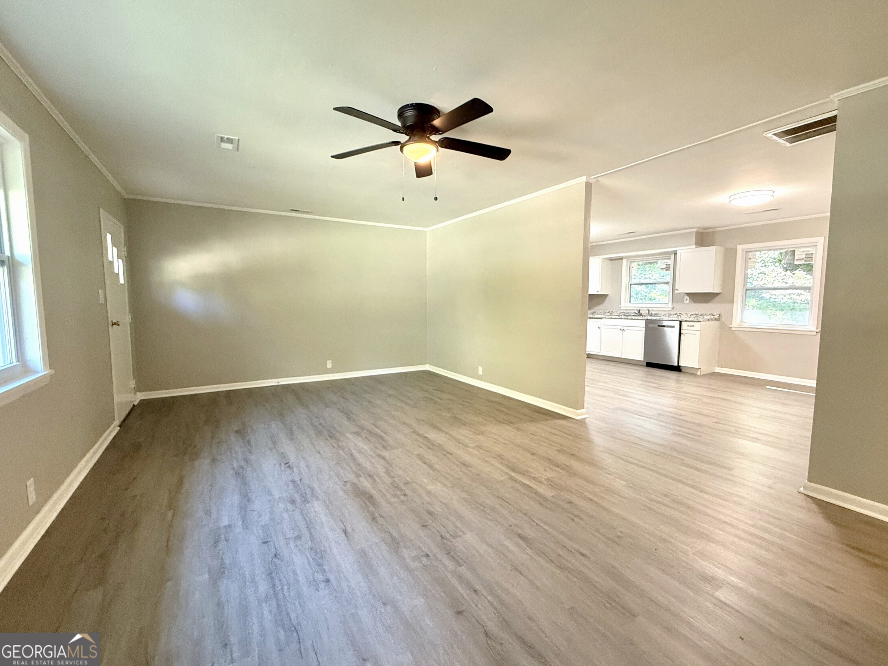 226 Poplar Street Toccoa, GA 30577 - Photo 6 of 17 a view of empty room with wooden floor and window