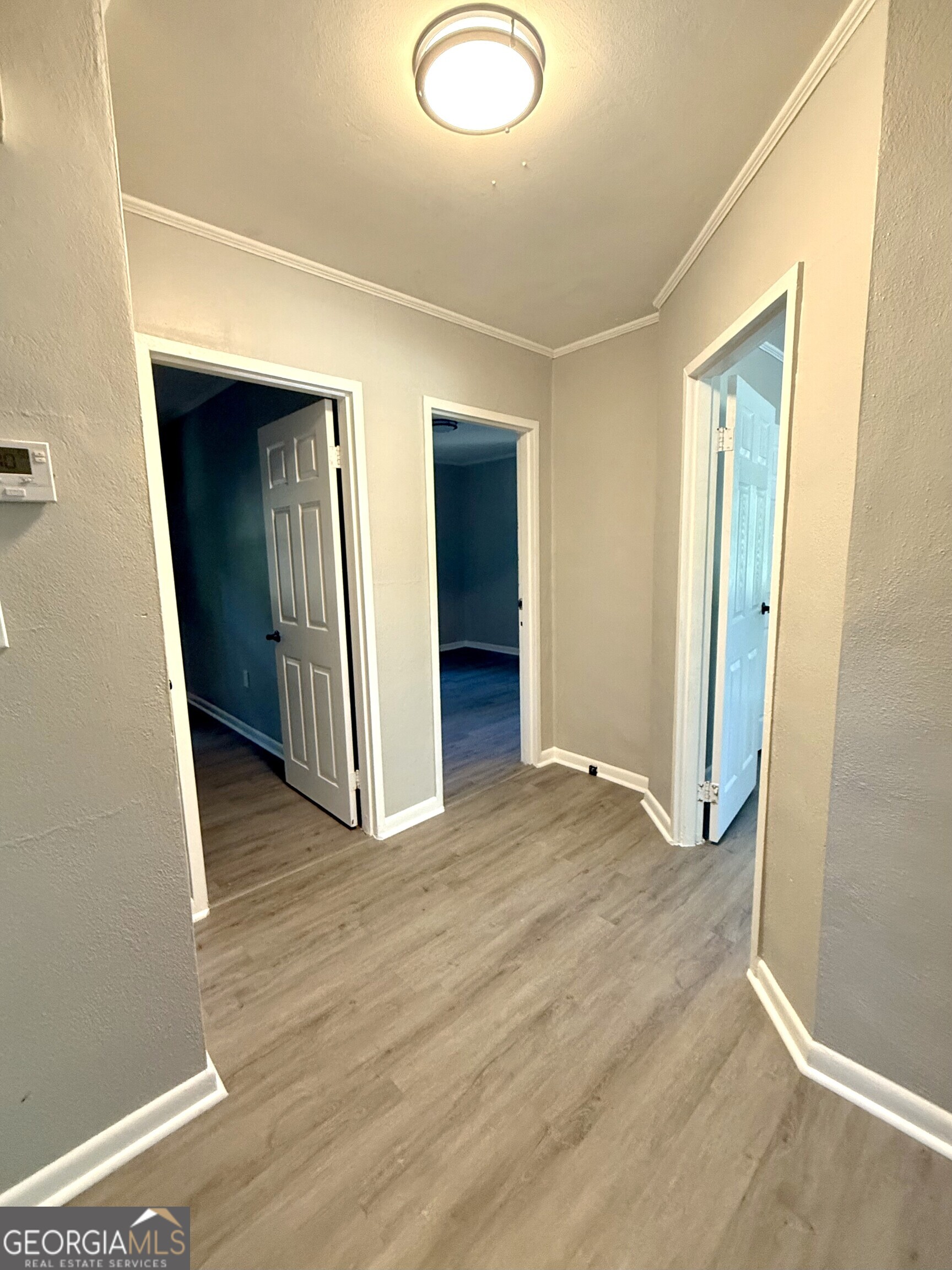 226 Poplar Street Toccoa, GA 30577 - Photo 7 of 17 an empty room with wooden floor and closet