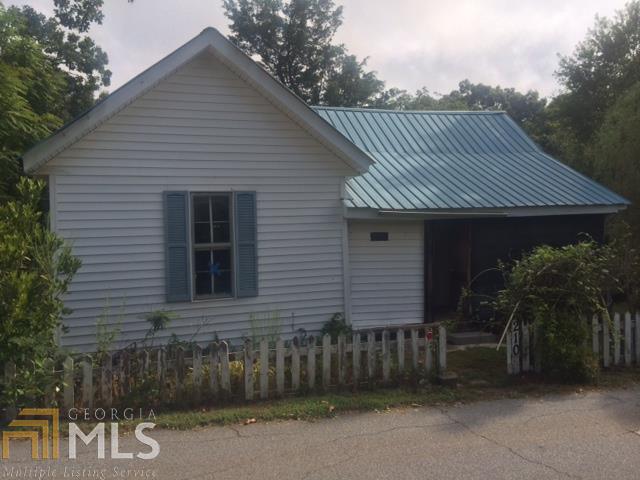 210 Stark Street Commerce, GA 30529 - Photo 1 of 1 a front view of a house with a garden
