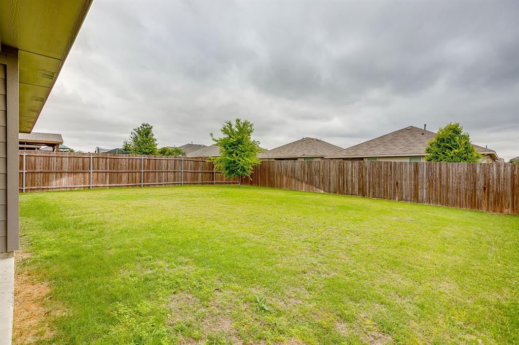 2313 Stallings Road Fort Worth, TX 76108 - Photo 30 of 30 a view of a yard with wooden fence