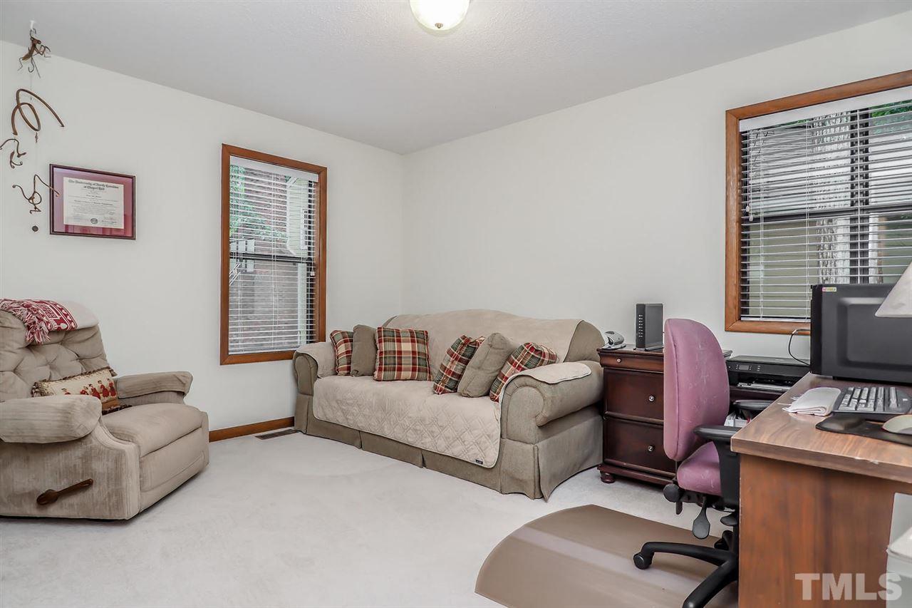 8804 Life Lane Raleigh, NC 27615 - Photo 22 of 25 a living room with furniture and a window