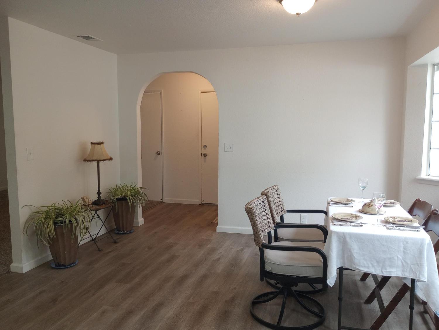 1432 Don Pedro Road Ceres, CA 95307 - Photo 12 of 56 a view of a dining room with furniture and wooden floor