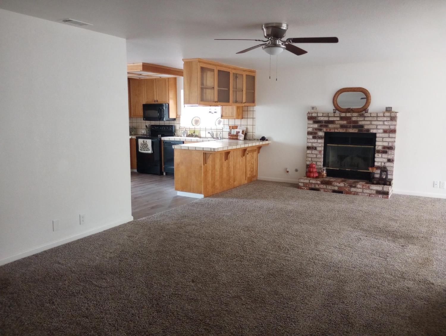 1432 Don Pedro Road Ceres, CA 95307 - Photo 17 of 56 a kitchen with stainless steel appliances a stove and a refrigerator