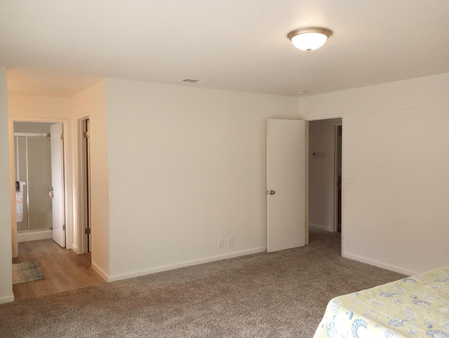 1432 Don Pedro Road Ceres, CA 95307 - Photo 22 of 56 a view of a livingroom with wooden floor and closet