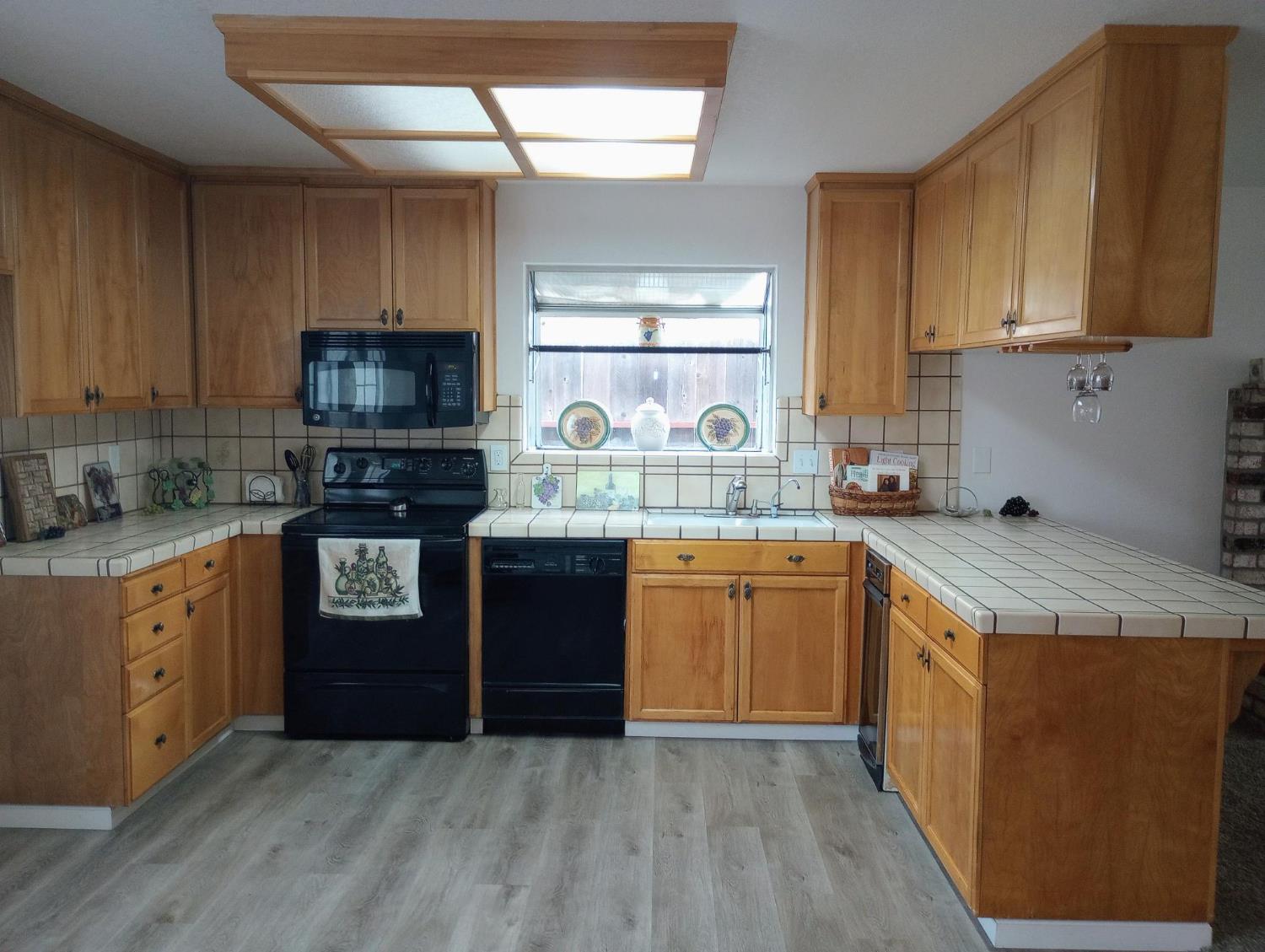 1432 Don Pedro Road Ceres, CA 95307 - Photo 9 of 56 a kitchen with a sink stove and microwave