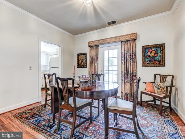 a view of a dining room with furniture and window
