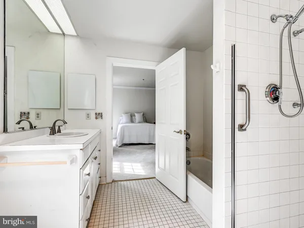 a bathroom with a sink and mirror