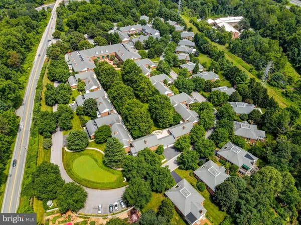 a outdoor space with lots of tables a garden and chairs