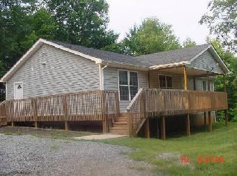 4783 Waidsboro Road Ferrum, VA 24088 - Photo 1 of 1 a view of backyard with small cabin and wooden fence