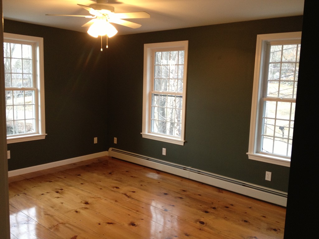 860 Podunk Road East Brookfield, MA 01515 - Photo 15 of 18 a view of an empty room with wooden floor and windows