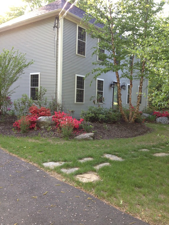 860 Podunk Road East Brookfield, MA 01515 - Photo 16 of 18 a front view of a house with a yard