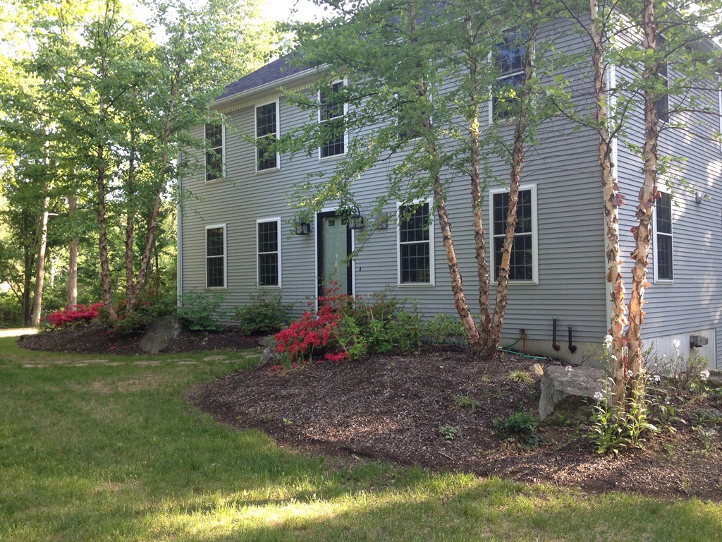 860 Podunk Road East Brookfield, MA 01515 - Photo 17 of 18 a front view of a house with garden