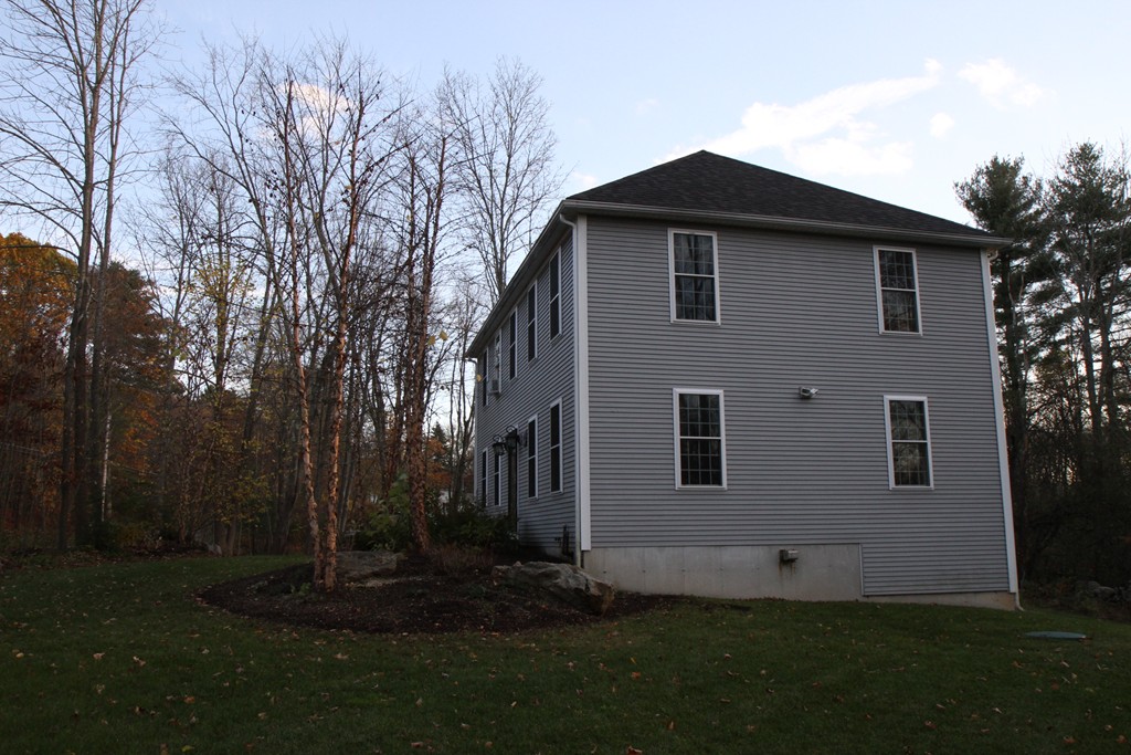 860 Podunk Road East Brookfield, MA 01515 - Photo 2 of 18 a front view of a house with garden