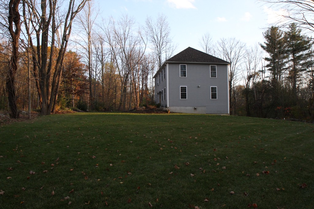 860 Podunk Road East Brookfield, MA 01515 - Photo 3 of 18 a front view of a house with garden
